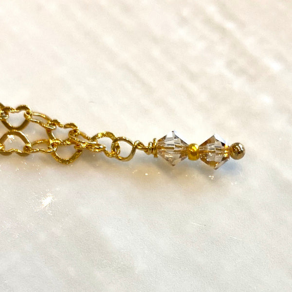 Gold plated sterling silver charm style bracelet with Swarovski crystal elements