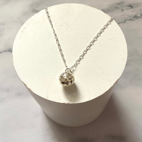 Hidden pearl silver plated cage pendant