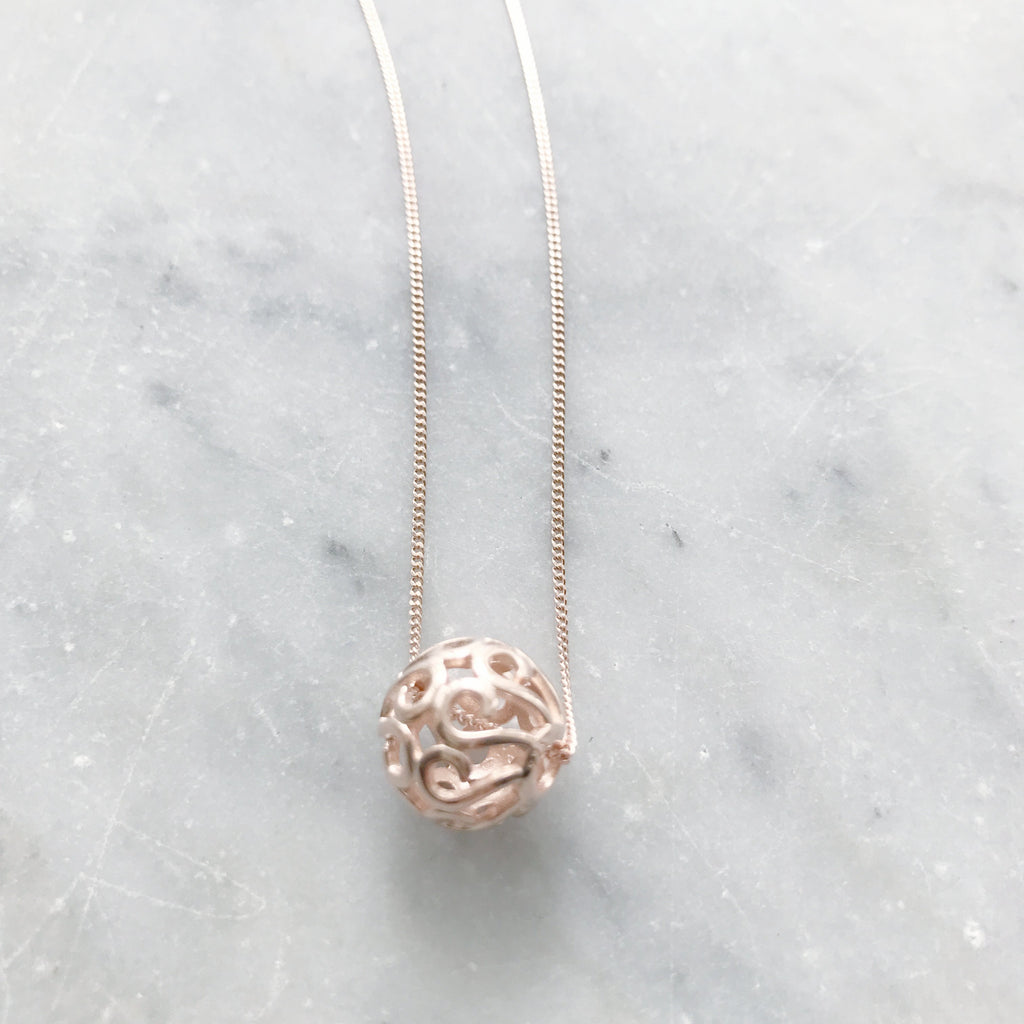 Rose gold sterling silver ball pendant