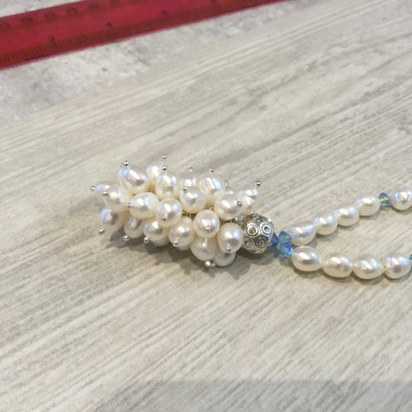 Ivory freshwater cultured pearl necklace with blue swarovski crystal elements