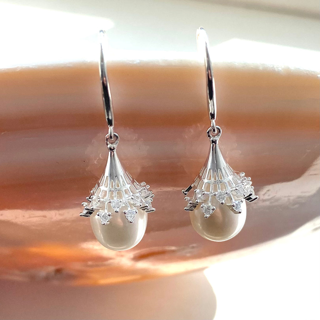 Pearl and silver statement earrings