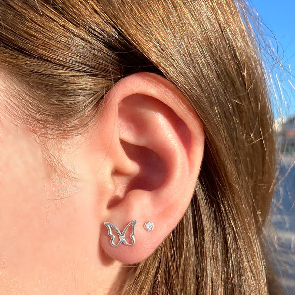 Butterfly outline stud earrings