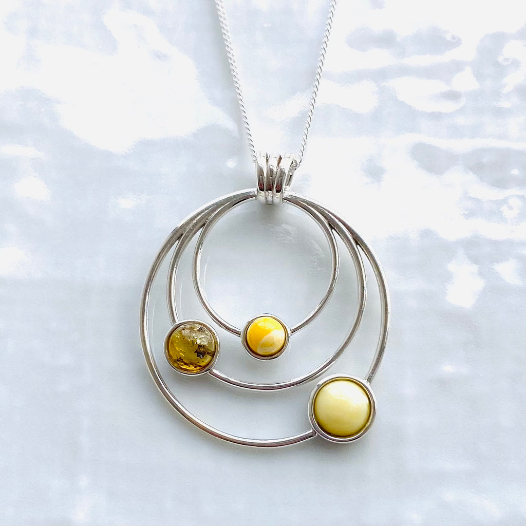 Baltic amber solar system pendant