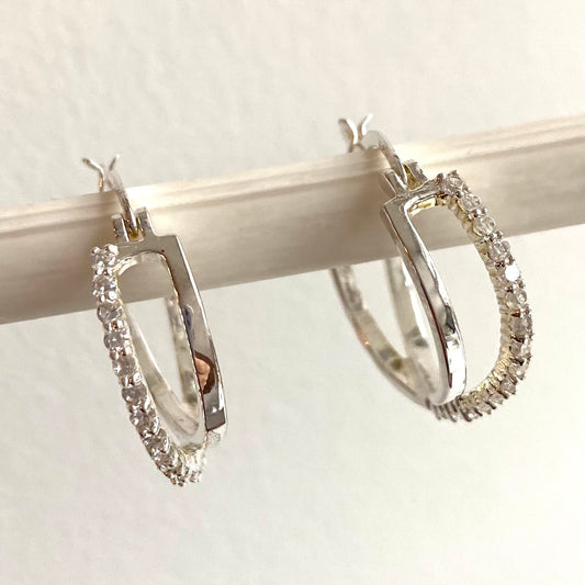 Statement cubic zirconia encrusted intertwined hoops